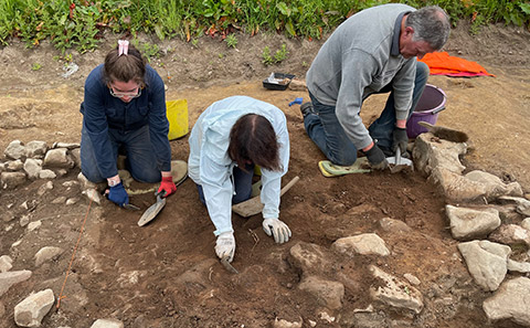 Archaeologists excavating at the dig site. Credit: Midas Media