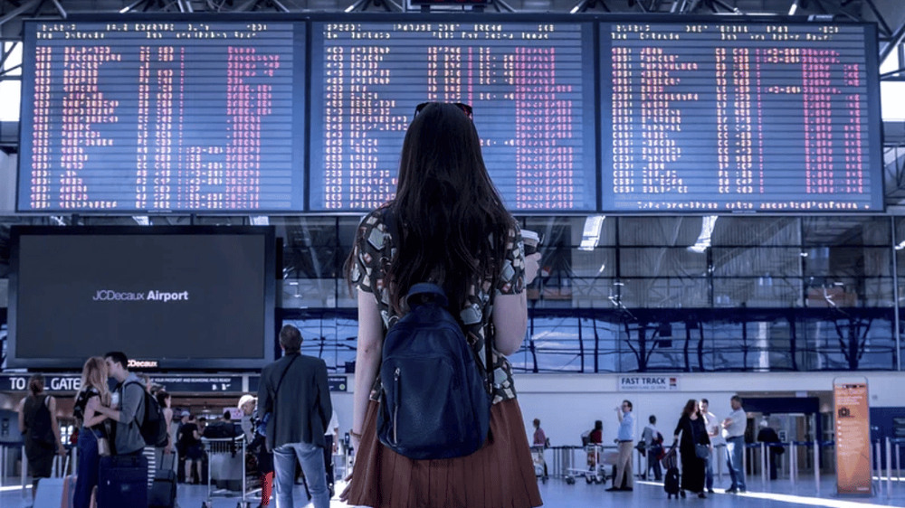 Woman at airport. Source Wikipedia Commons