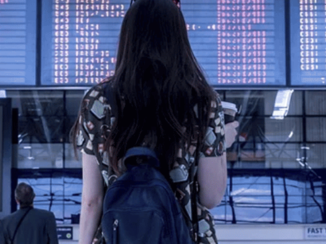 Woman at airport. Source Wikipedia Commons