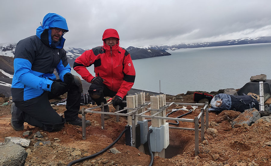 Miguel Araiz (left) and David Astrain, next to one of the geothermal thermoelectric generators, which harness the Earth's heat to generate electricity.