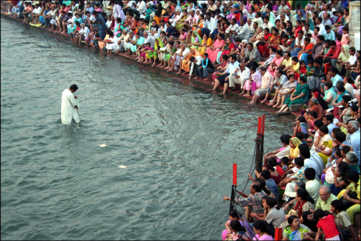 A public prayer in the River Ganges in the Indian holy city of Haridwar.