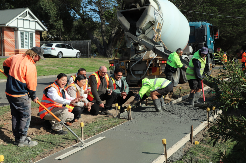 The pour of the coffee and wood-chip biochar concrete for the footpath trial in Gisborne took place earlier this month. Photo Credit: Bodey Dittloff, Macedon Ranges Shire Council