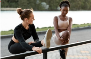 Women working out together outdoors.