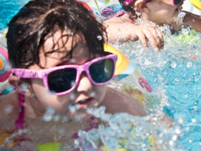 2 Girl's Swimming during Daytime trying to beat the heat. Photo Credit: Juan Salamanca, Pexels