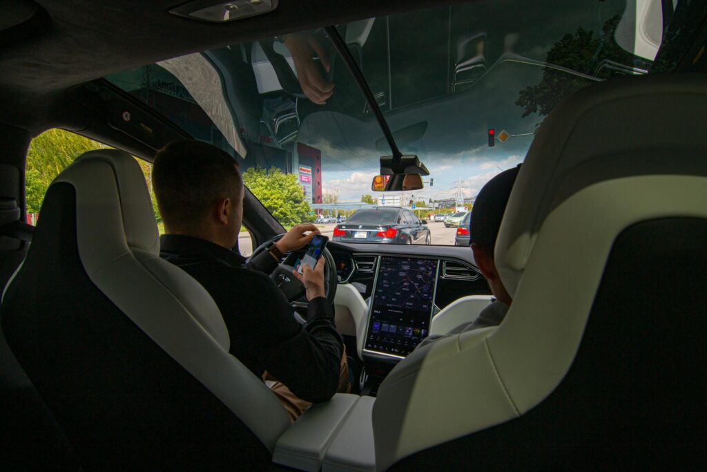 Man Driving a Tesla.