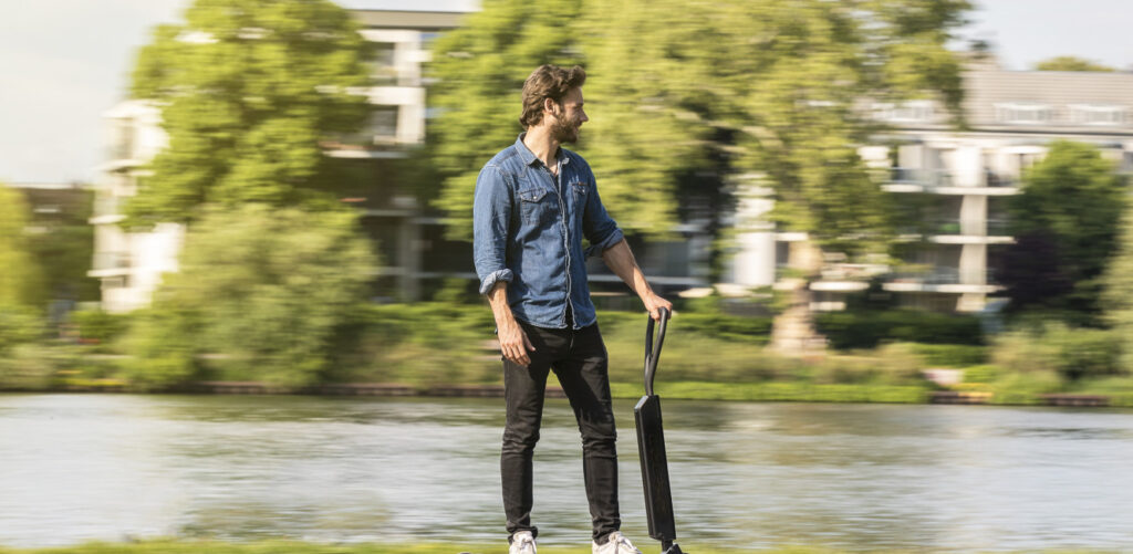 Man Riding Electric Scooter.