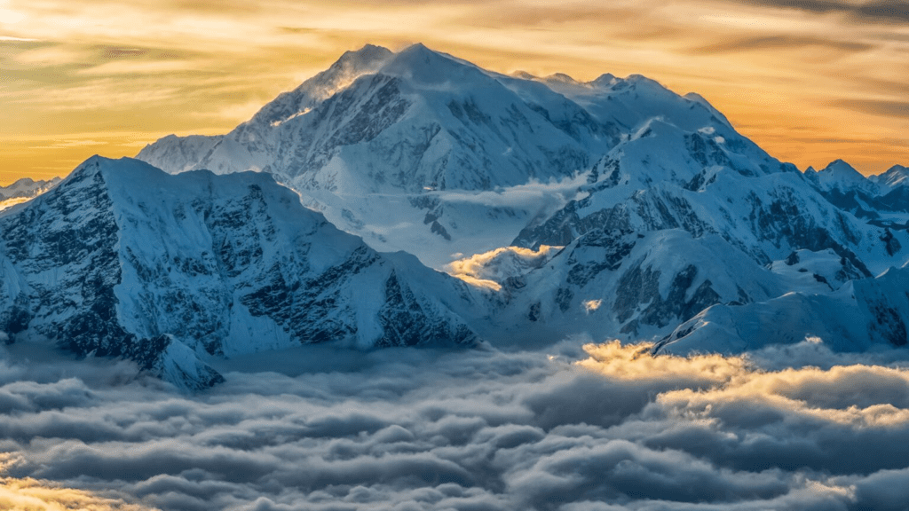 Aerial image of Mount Logan rising above the clouds in Kluane National Park and Reserve, Yukon, Canada
