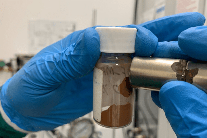A magnet attracts the material that the team used to make adsorbents that remove microplastics and dissolved pollutants from water, at RMIT University