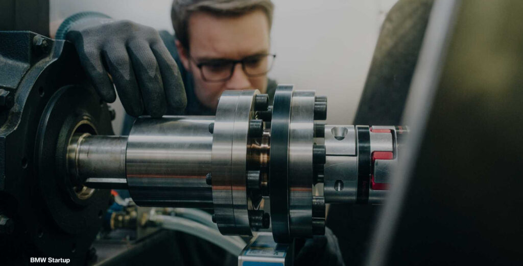 Engineer working on industrial machinery. Photo Source : BMW Group