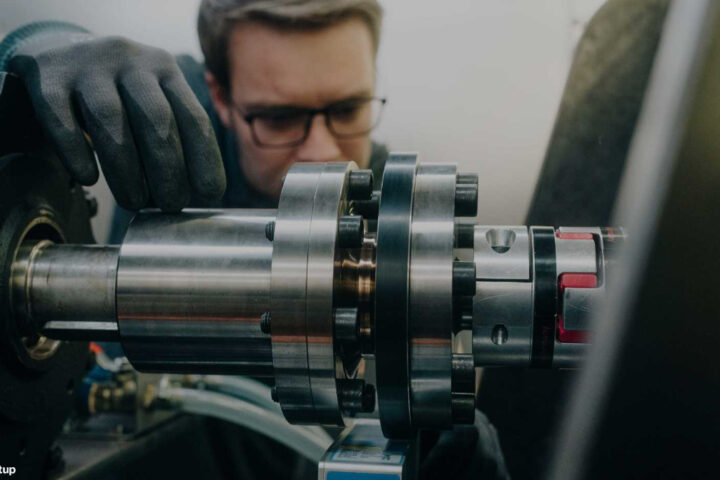 Engineer working on industrial machinery. Photo Source : BMW Group