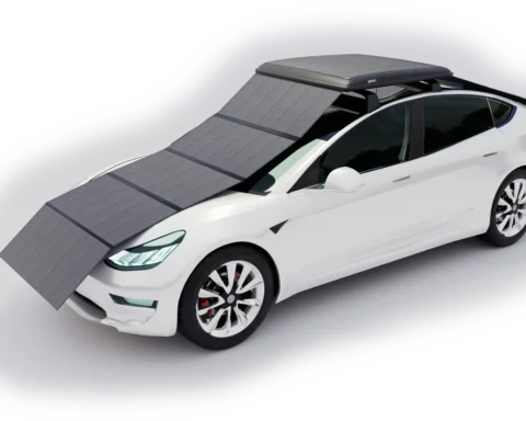 An electric car equipped with foldable solar panels covering the hood, roof, and windshield area. Photo Source: GoSun