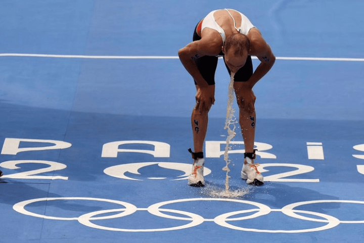 Athlete vomit in Paris 2024 Olympic after Swimming in Polluted Seine River. Photo Credits: @therealmislawchuk (Instagram)