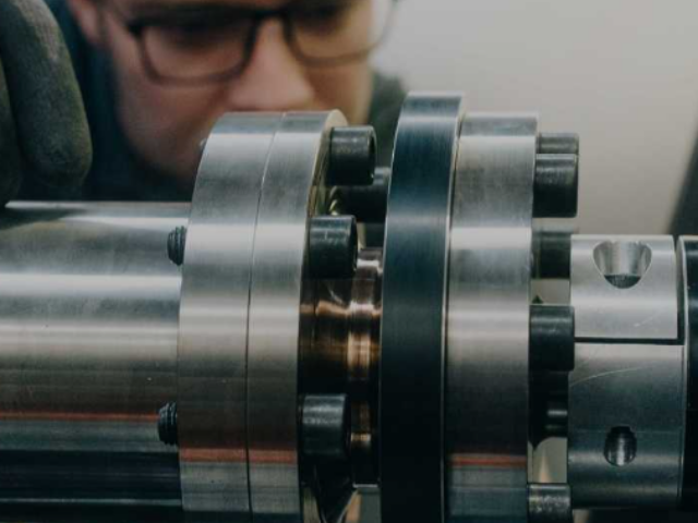 Engineer working on industrial machinery. Photo Source : BMW Group