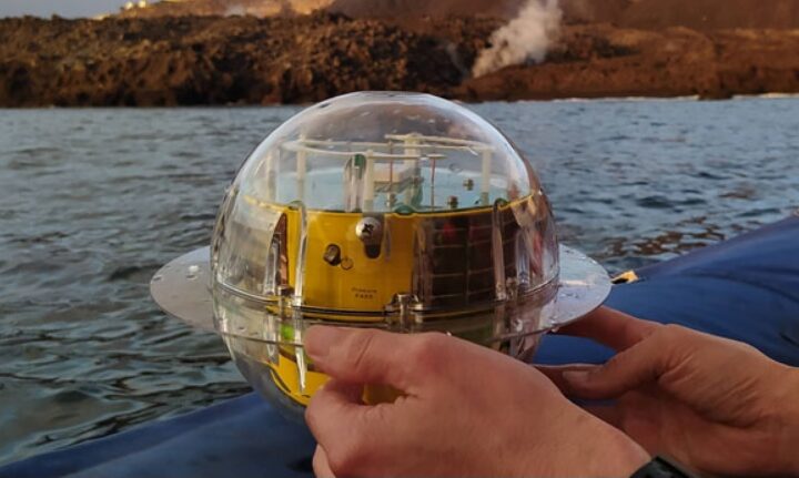 A person is holding a buoys device.