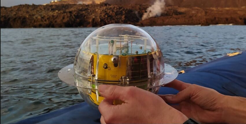 A person is holding a buoys device.