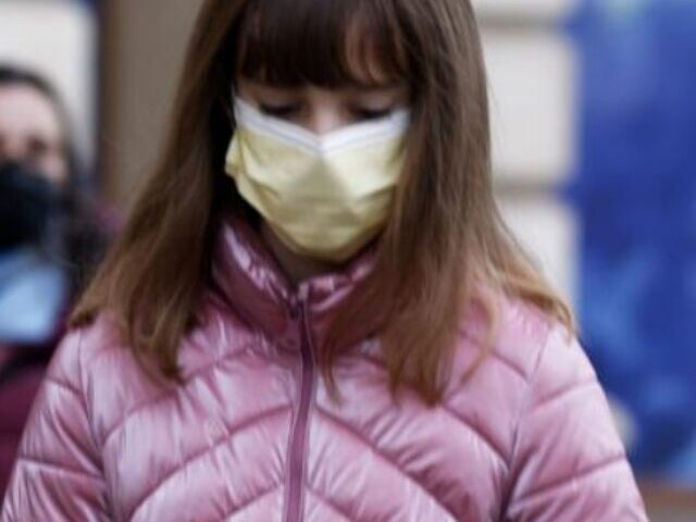 A Little girl with face mask.