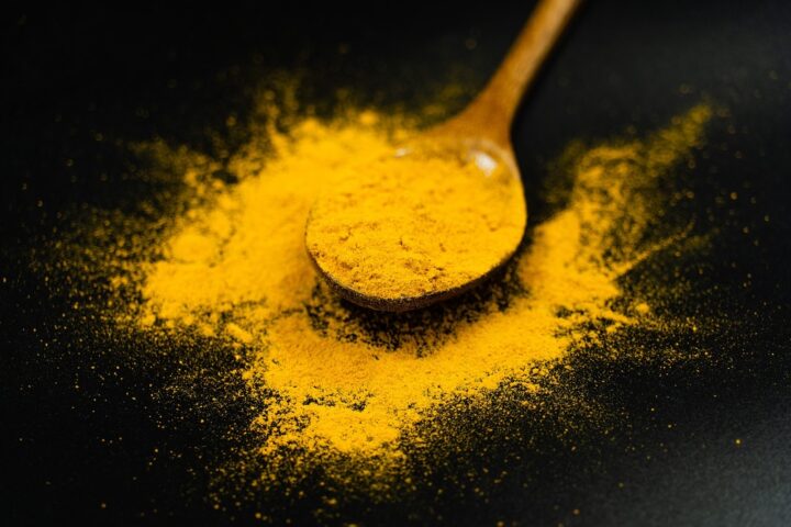 Turmeric Powder on a Spoon.