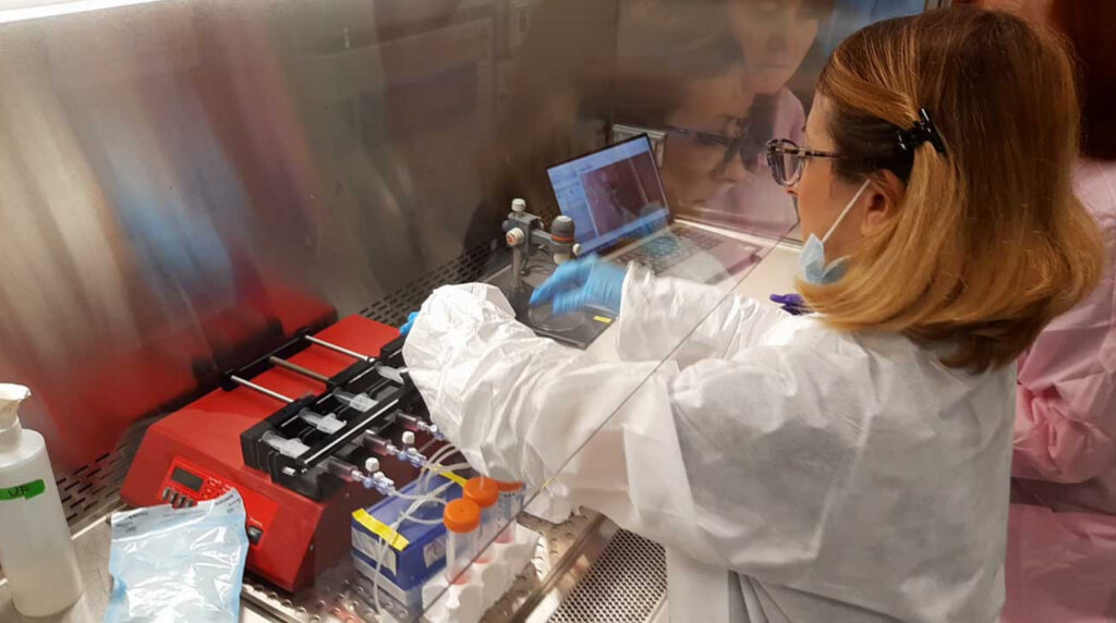 Maddalena Parafati at Kennedy Space Center preparing the programmable syringe pumps that dispense the culture media at fixed reproducible flow rates into the tissue chips.