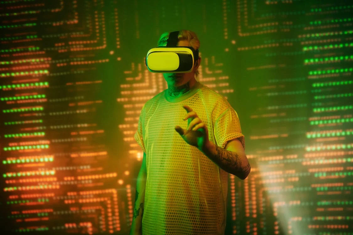 Representative Image. Man in Yellow Shirt Wearing White and Black VR Goggles,