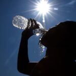 Representative Image. Summer weather can be unpredictable. Increasing water intake can help people avoid heat exhaustion when working or playing outdoors. Photo Source: Roland Schedel (U.S Army)