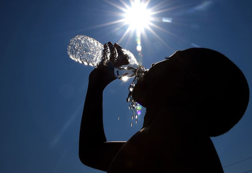 Representative Image. Summer weather can be unpredictable. Increasing water intake can help people avoid heat exhaustion when working or playing outdoors. Photo Source: Roland Schedel (U.S Army)