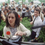 Lois Gibbs never avoided the spotlight in her fight to protect Love Canal's families from chemical waste. The press surrounds her outside the Love Canal Homeowners Association in 1980 as Gibbs waits for a phone call from the White House. Photograph By Mickey H. Osterreicher