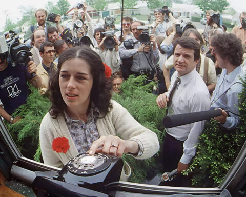 Lois Gibbs never avoided the spotlight in her fight to protect Love Canal's families from chemical waste. The press surrounds her outside the Love Canal Homeowners Association in 1980 as Gibbs waits for a phone call from the White House. Photograph By Mickey H. Osterreicher