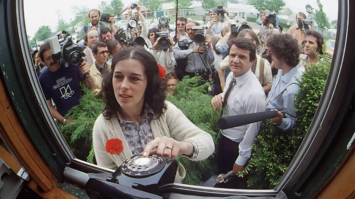 Lois Gibbs never avoided the spotlight in her fight to protect Love Canal's families from chemical waste. The press surrounds her outside the Love Canal Homeowners Association in 1980 as Gibbs waits for a phone call from the White House. Photograph By Mickey H. Osterreicher