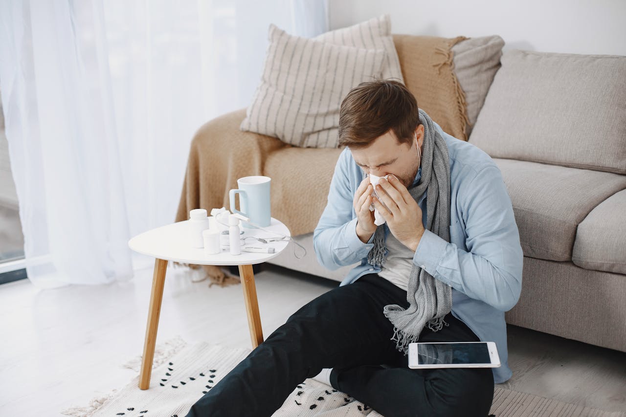 Representative Image. A sick person wiping his nose with tissue. Photo Source: Gustavo Fring (Pexels)