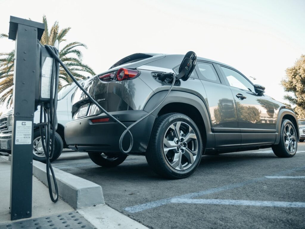 Representative Image. Gray Electric Car Parked on a Charging Bay. Photo Source: Kindel Media (Pexels)