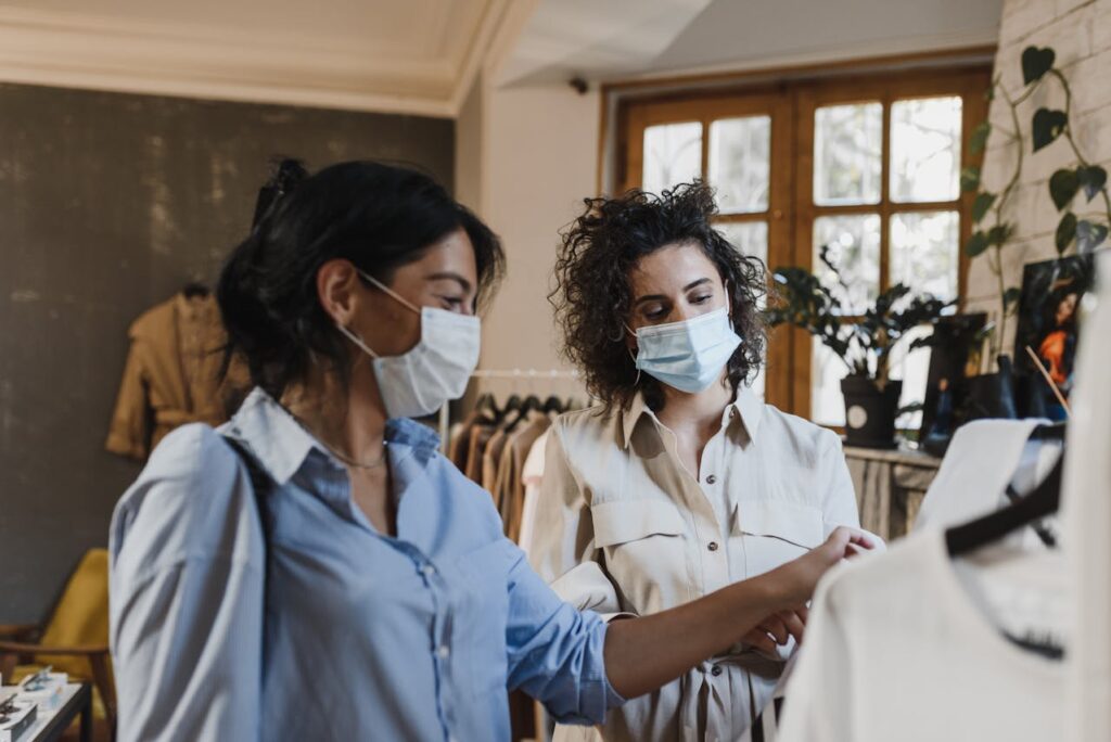 Representative Image. Woman in Blue Button Up Shirt Wearing Face Mask. Photo Source: Arina Krasnikova (Pexels)