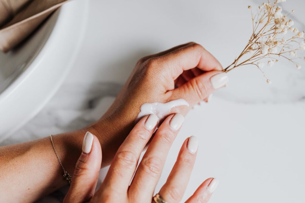 Representative Image. Person applying lotion on hand.