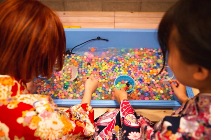 Representative Image. Crop unrecognizable girl washing fishbowl beads in basin. Photo Source: Ryutaro Tsukata (Pexels)