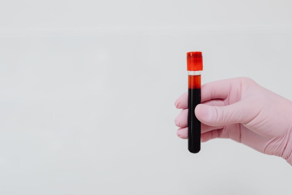 Representative Image. Person in Pink Gloves Holding a Test Tube. Photo Source: Kaboompics (Pexels)