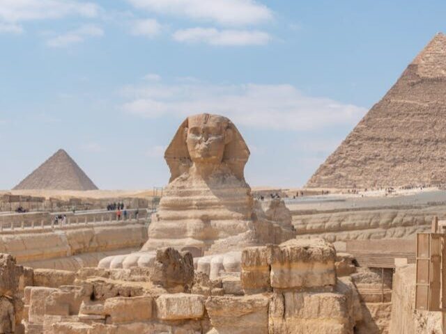 Pyramids and Sphinx Statue in Desert