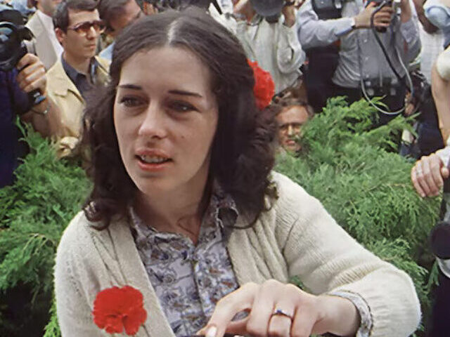 Lois Gibbs never avoided the spotlight in her fight to protect Love Canal's families from chemical waste. The press surrounds her outside the Love Canal Homeowners Association in 1980 as Gibbs waits for a phone call from the White House. Photograph By Mickey H. Osterreicher