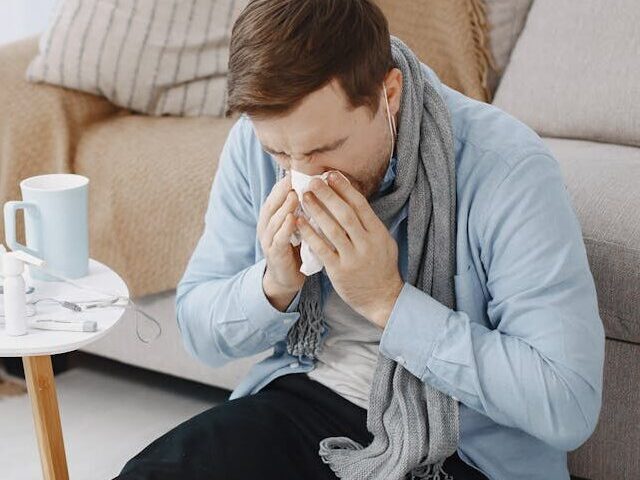 Representative Image. A sick person wiping his nose with tissue. Photo Source: Gustavo Fring (Pexels)