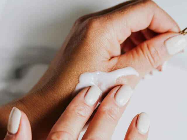 Representative Image. Person applying lotion on hand. Photo Source: Kaboom pics (Pexels)