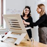 Representative Image. Woman Phone Desk Stand. Photo Credit: Standsome (Pixabay)