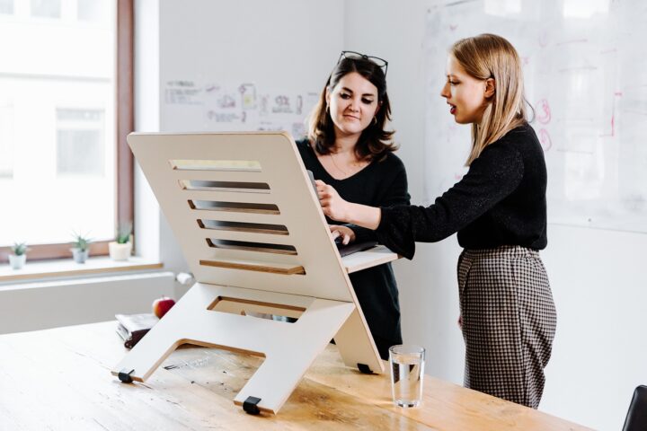 Representative Image. Woman Phone Desk Stand. Photo Credit: Standsome (Pixabay)