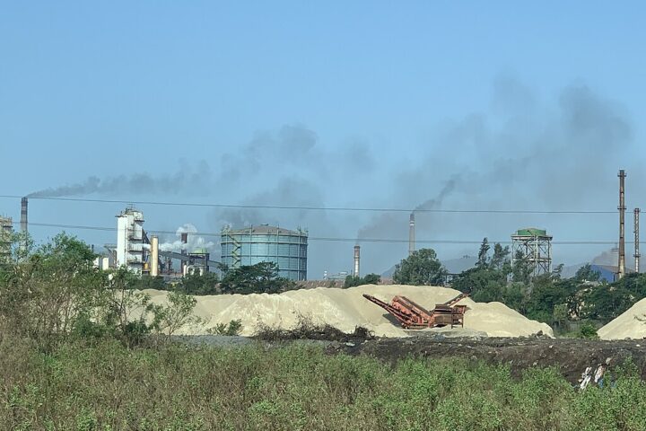 Representative Image. Industrial air pollution near Mumbai. Against the blue skies brought about by the minimal pollution. Photo Source: Sumaira Abdulali (CC BY-SA 4.0)