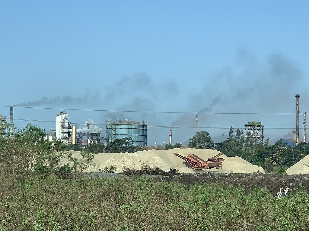 Representative Image. Industrial air pollution near Mumbai. Against the blue skies brought about by the minimal pollution. Photo Source: Sumaira Abdulali (CC BY-SA 4.0)