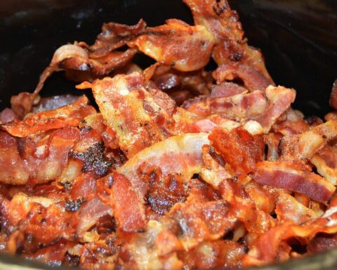 Representative Image. a pile of cooked bacon strips. The bacon appears crispy and well-cooked, with a mix of reddish-brown and golden colors. Source - Pixabay