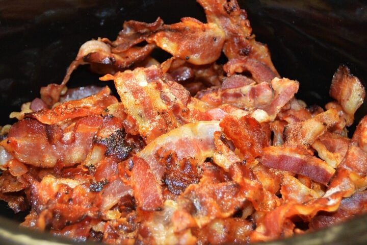 Representative Image. a pile of cooked bacon strips. The bacon appears crispy and well-cooked, with a mix of reddish-brown and golden colors. Source - Pixabay