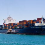 Representative Image. Container ship transporting cargo in harbor.. Photo Source: Gnangarra (CC BY 2.5 AU)