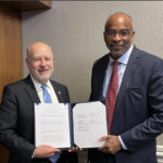 Dr. Rick Spinrad, NOAA administrator (left), and Dr. Everette Joseph, Director of the National Center for Atmospheric Research, hold up an expanded Memorandum of Understanding on December 10, 2024 in Washington DC. The MOU will strengthen the partnership between NOAA and NCAR to advance and accelerate our understanding and application of Earth system science. (Photo Source: NOAA)