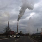 Smoggy cityscape with industrial pollution.