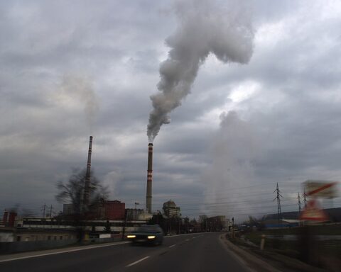 Smoggy cityscape with industrial pollution.