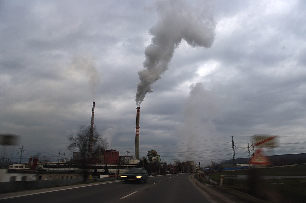 Smoggy cityscape with industrial pollution.