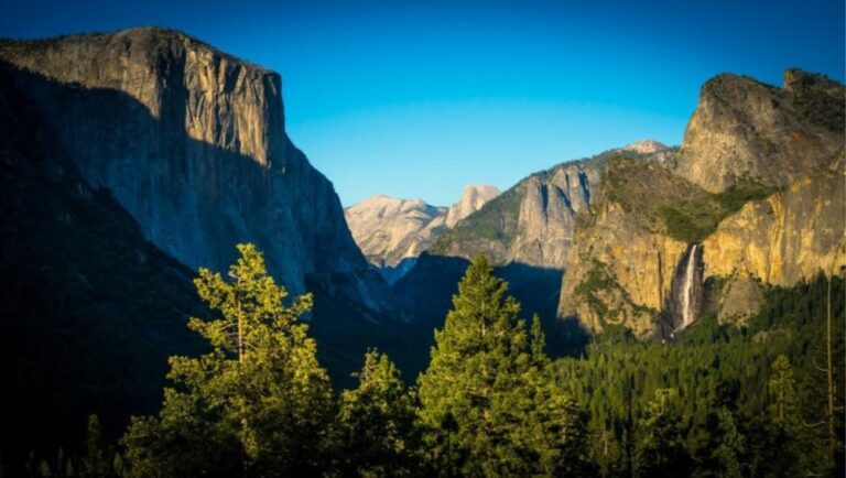 Representative Image. Landscape day view of Yosemite Valley with trees and blue sky. Photo Source: Pexels